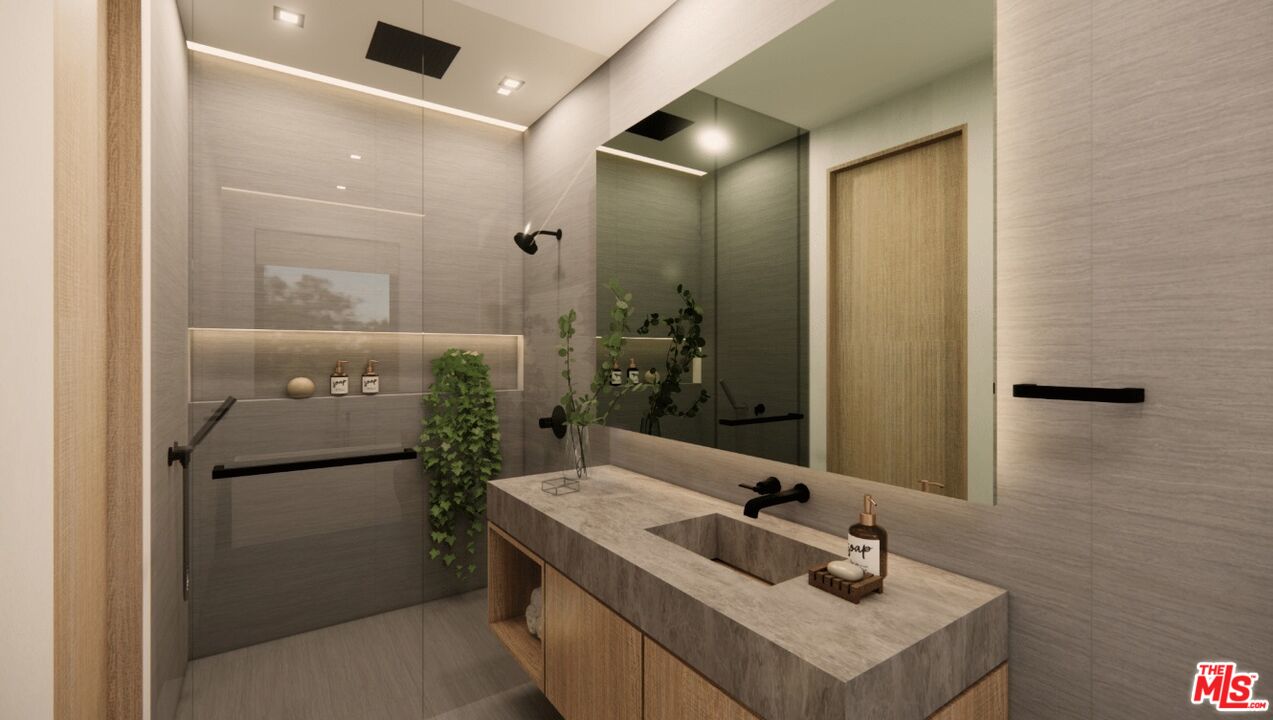 590 North Tigertail Road Los Angeles, CA 90049 - Photo 63 of 69 a bathroom with a sink and mirror