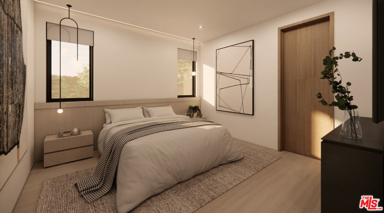 590 North Tigertail Road Los Angeles, CA 90049 - Photo 65 of 69 a bedroom with a bed and a chandelier