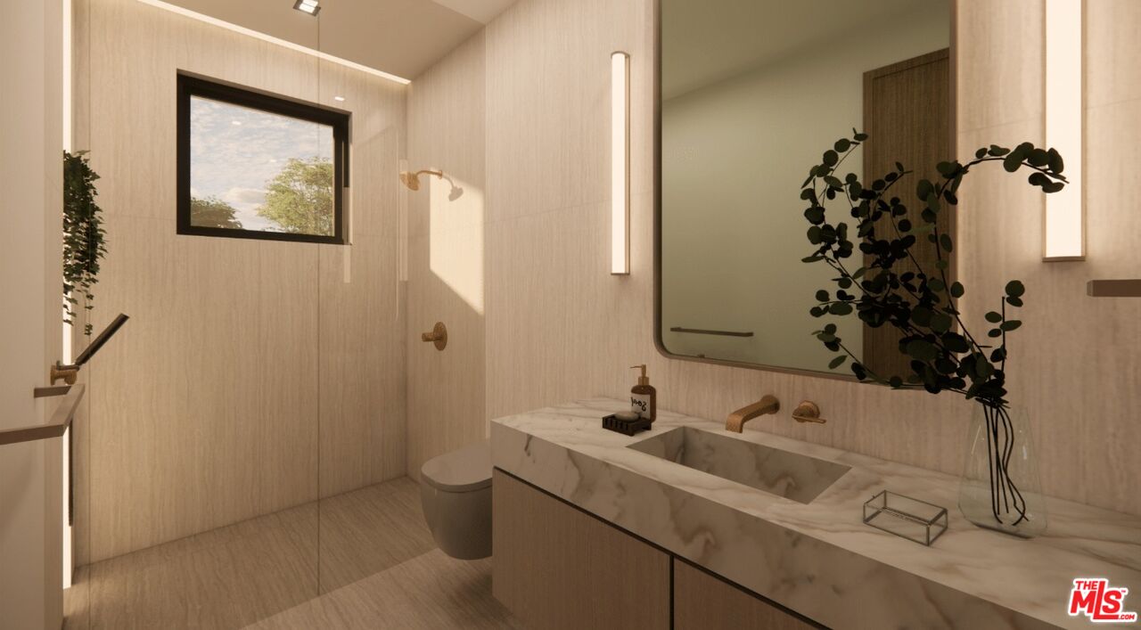 590 North Tigertail Road Los Angeles, CA 90049 - Photo 66 of 69 a bathroom with a sink and mirror with toilet