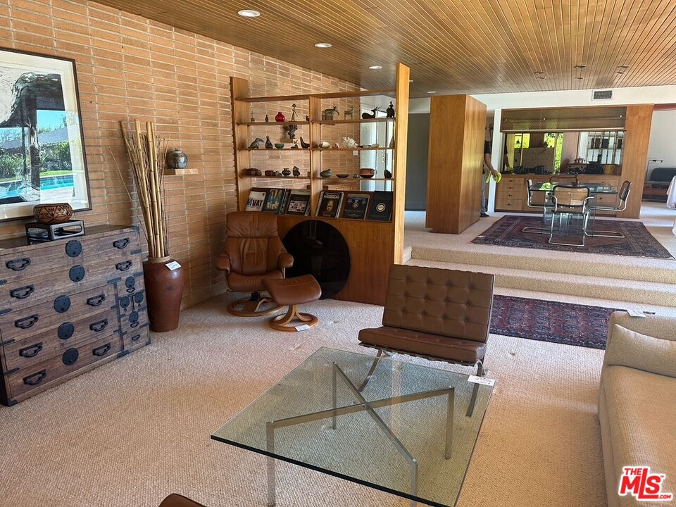 590 North Tigertail Road Los Angeles, CA 90049 - Photo 9 of 69 a view of a livingroom with furniture and windows