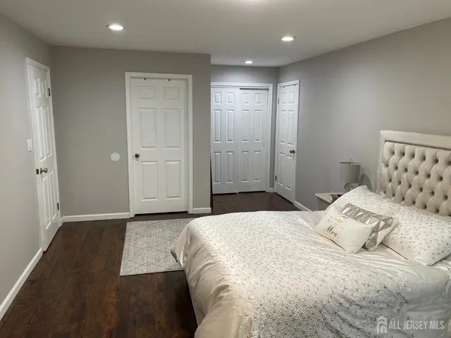 a bedroom with a bed and a walk in closet