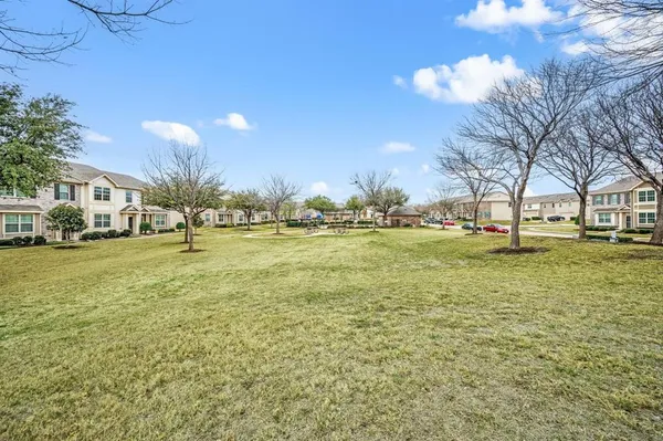 a view of yard with swimming pool and green space