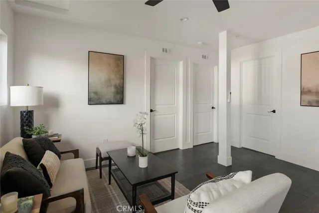 a kitchen with stainless steel appliances a stove microwave and sink