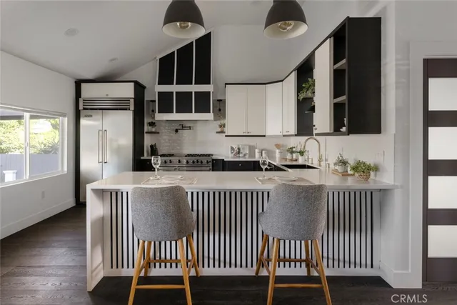 a kitchen with a window a sink and a cabinets