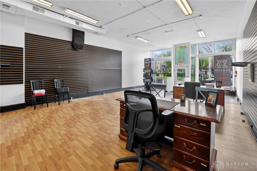 7045-7049 Montgomery Road Cincinnati, OH 45236 - Photo 68 of 68 This spacious office offers an open floorplan with large windows, ideal for a vibrant workspace.