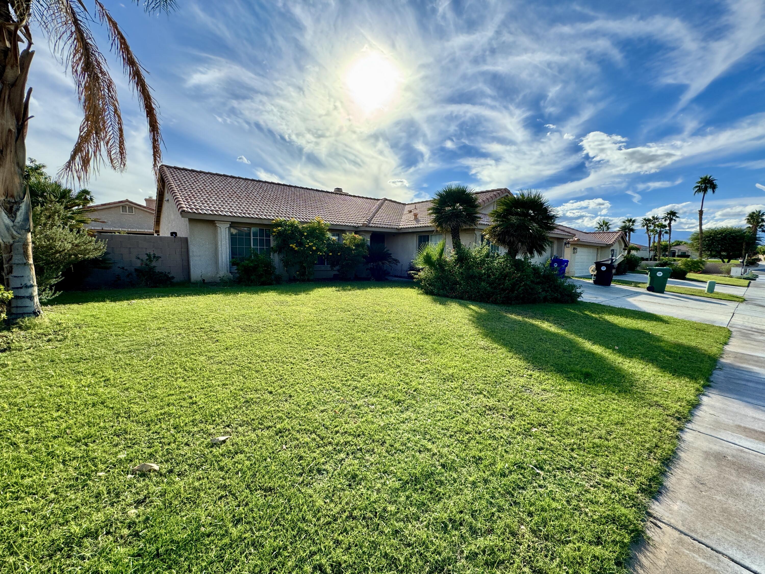 a view of a back yard of the house