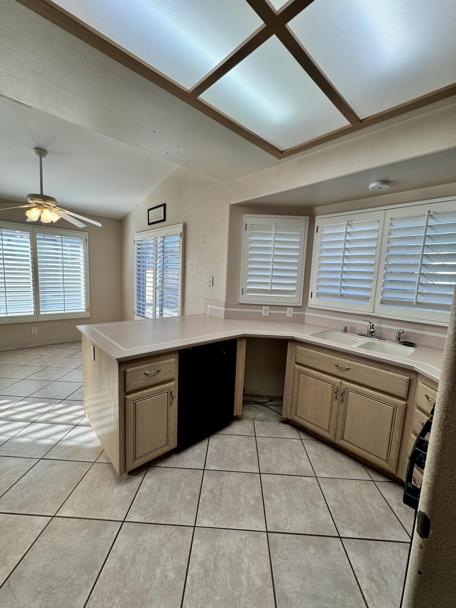 79585 Star Flower Trail La Quinta, CA 92253 - Photo 14 of 21 a kitchen with granite countertop a stove a sink a granite counter top and cabinets