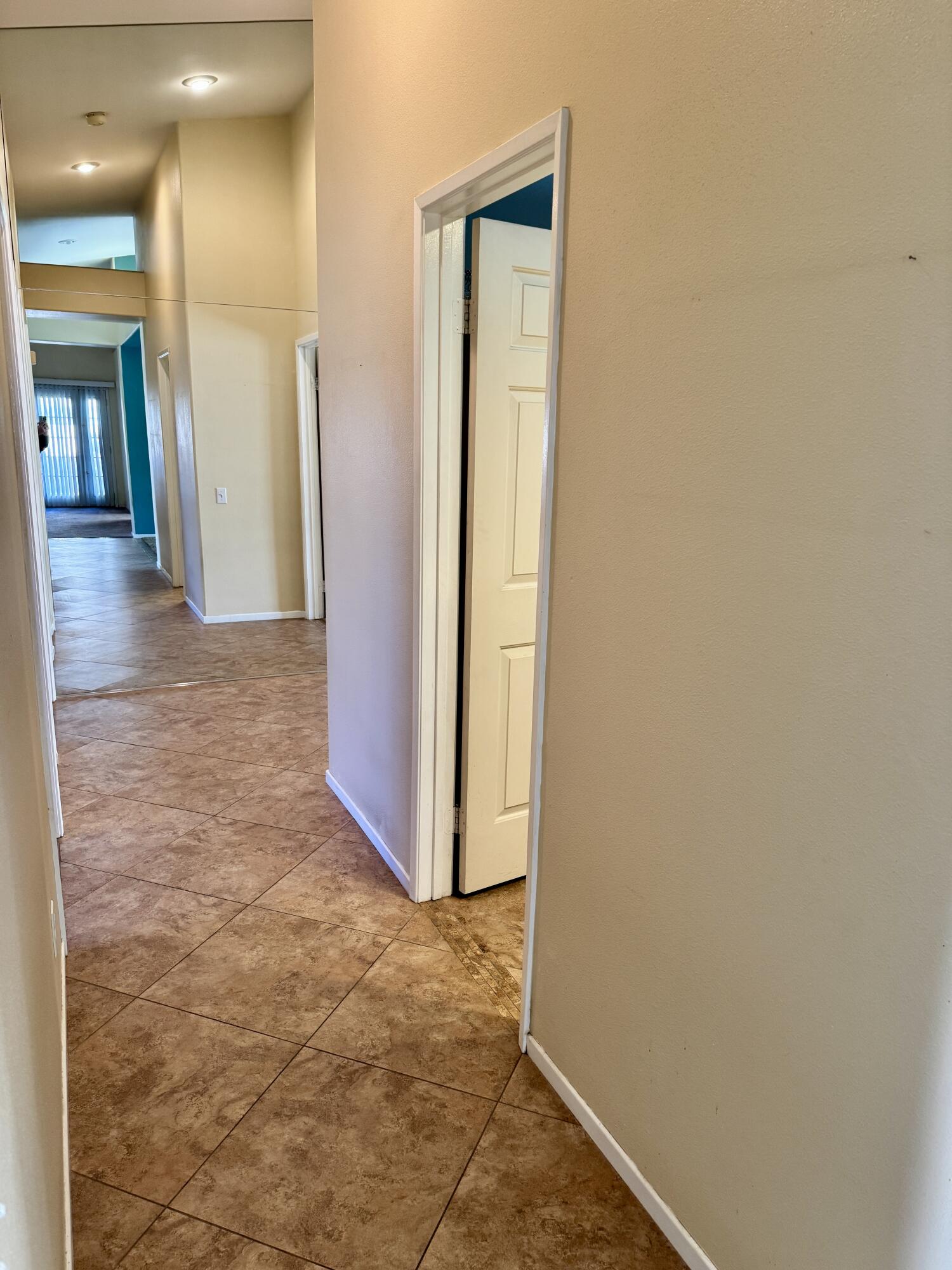 79585 Star Flower Trail La Quinta, CA 92253 - Photo 4 of 21 a view of a hallway with wooden floor