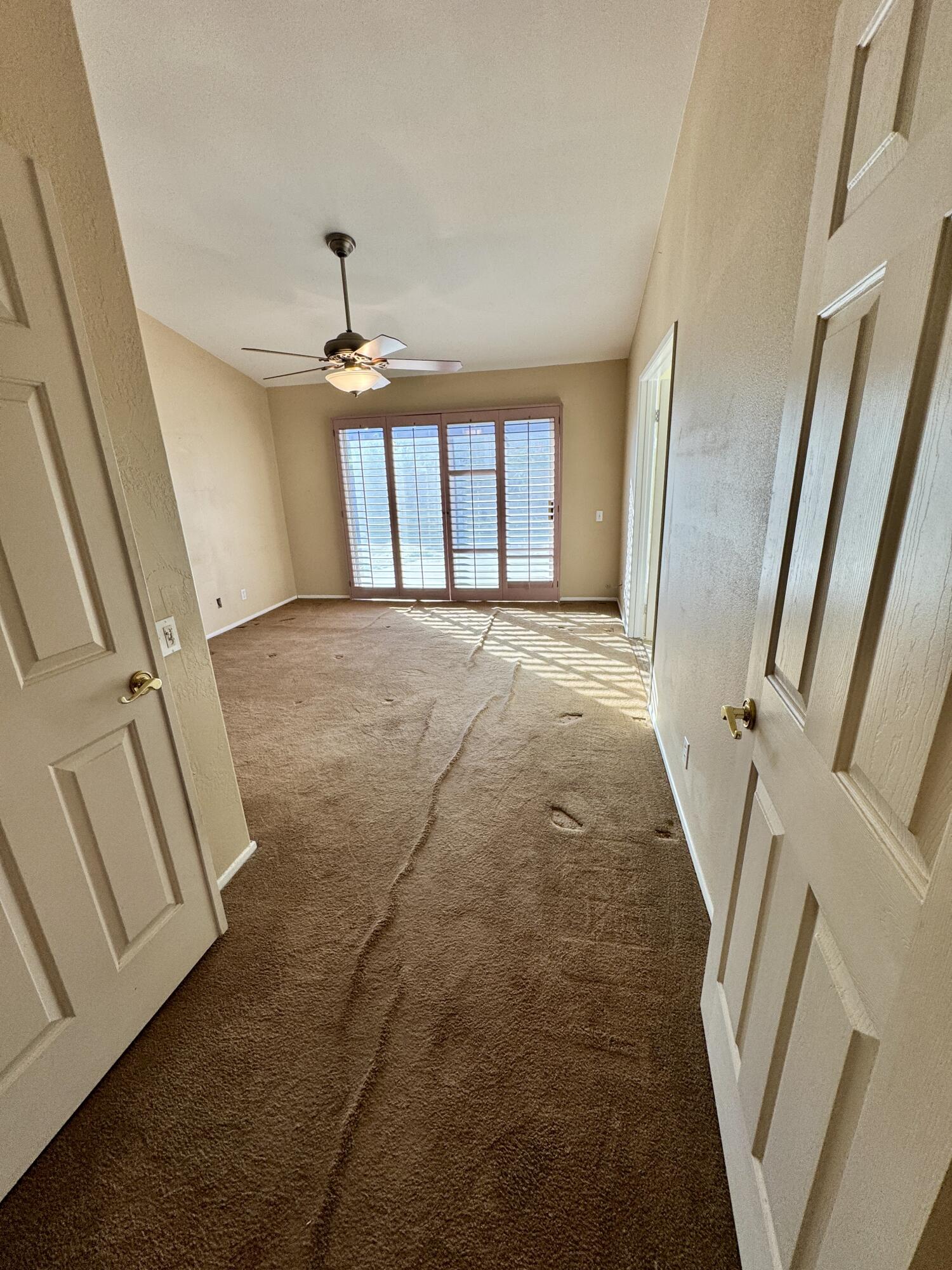 79585 Star Flower Trail La Quinta, CA 92253 - Photo 10 of 21 a view of an empty room with a window