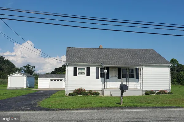 a house that has a tree in front of it