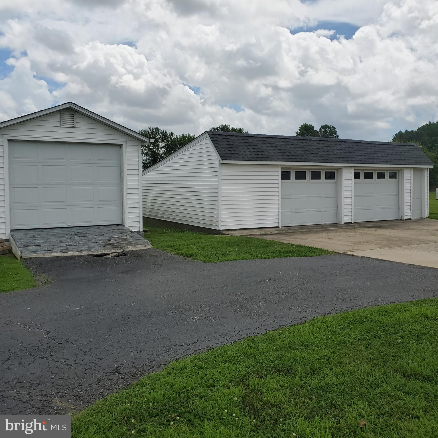 68 Amwellbury Road Salem, NJ 08079 - Photo 3 of 23 a view of a house with a yard and garage