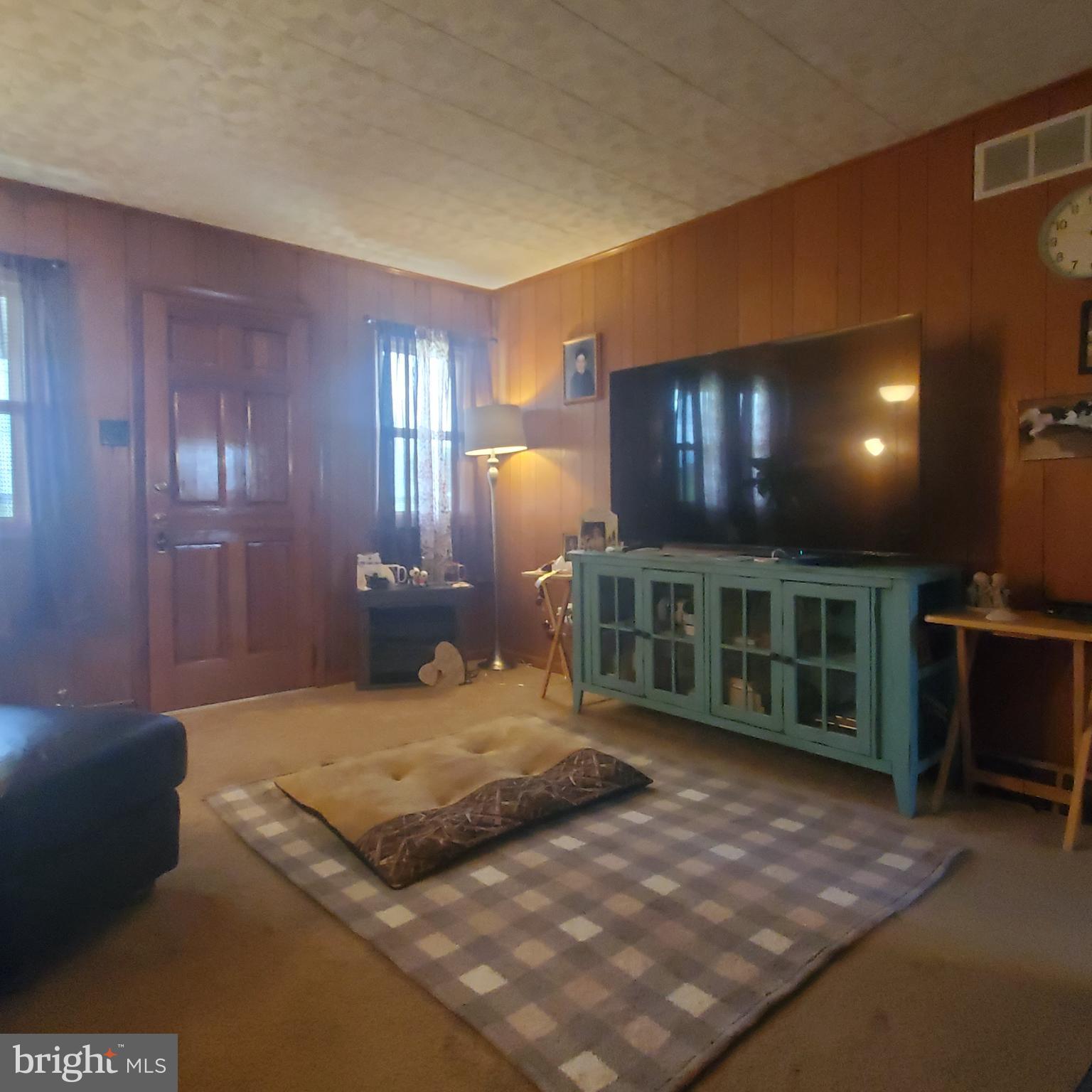 68 Amwellbury Road Salem, NJ 08079 - Photo 9 of 23 a bedroom with a large bed and a chandelier