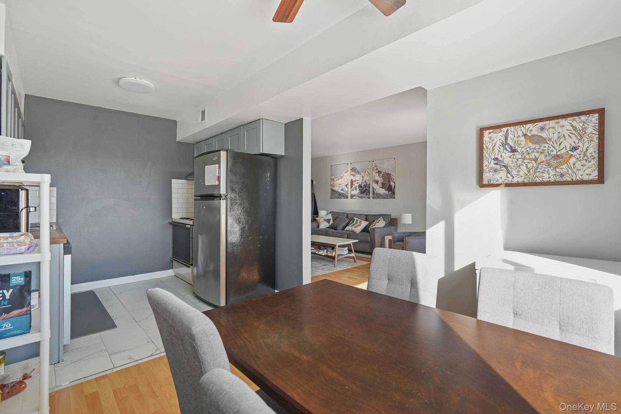 26 Cooper Road, Unit 411 Poughkeepsie, NY 12603 - Photo 10 of 17 Dining space featuring ceiling fan and light wood-style flooring