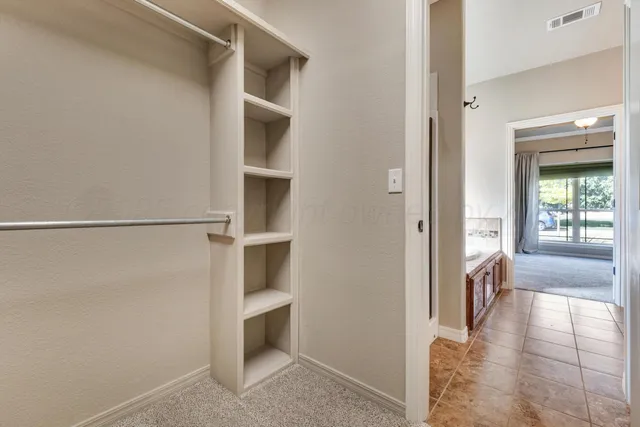 a view of an empty walk in closet