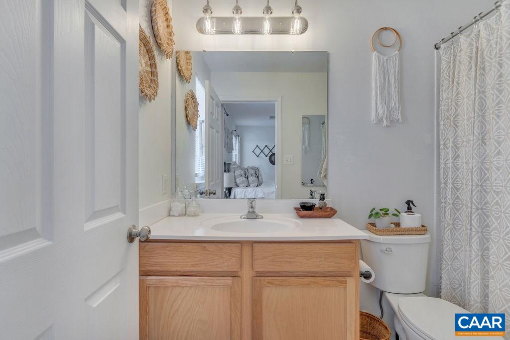 357 Rolkin Road Charlottesville, VA 22911 - Photo 15 of 37 a bathroom with a sink a toilet and a mirror
