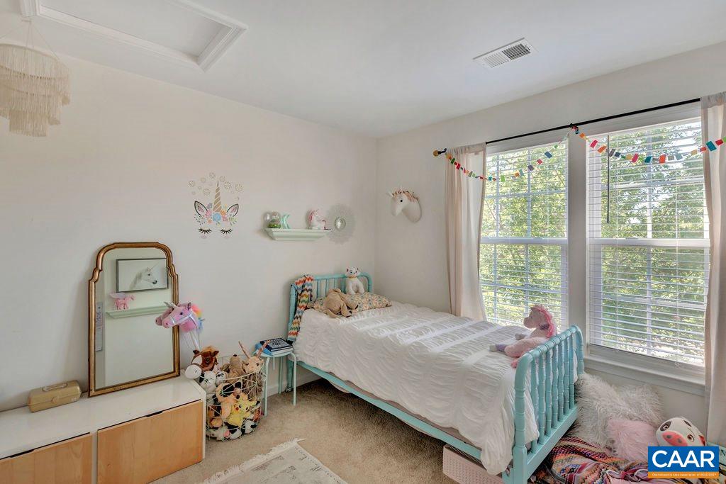 357 Rolkin Road Charlottesville, VA 22911 - Photo 17 of 37 a bedroom with a bed and a window