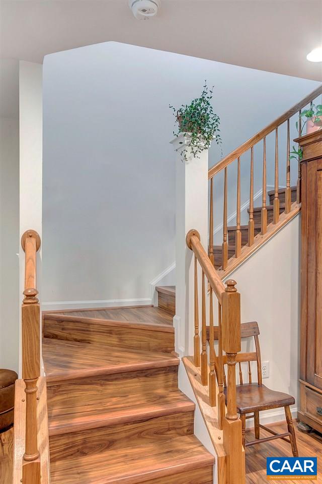 357 Rolkin Road Charlottesville, VA 22911 - Photo 24 of 37 a view of staircase with wooden floor and a potted plant