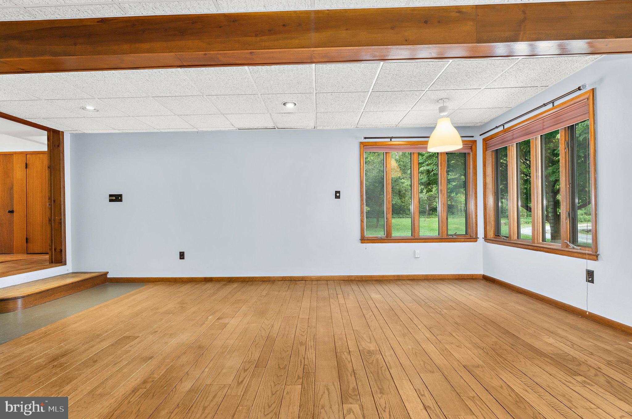 716 Andover Road Linthicum Heights, MD 21090 - Photo 16 of 48 a view of an empty room with wooden floor and a window