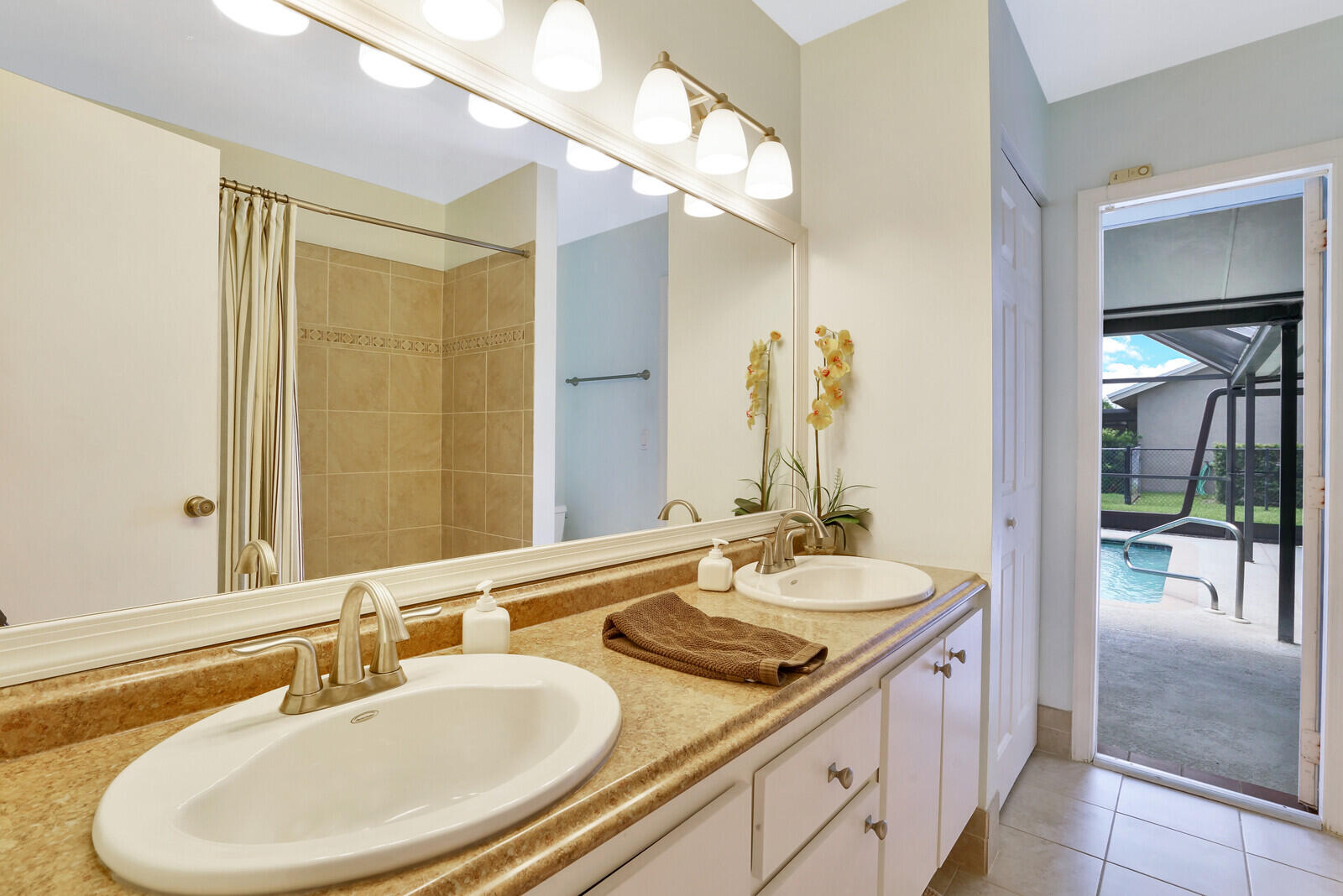 19620 Hampton Drive Boca Raton, FL 33434 - Photo 25 of 45 a bathroom with a sink and a mirror