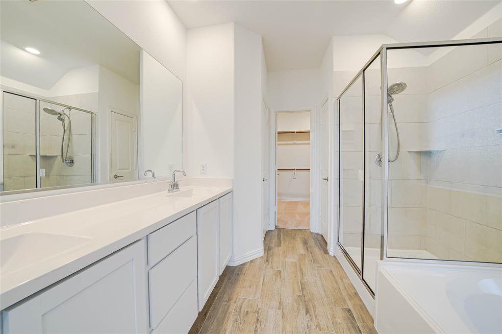 3420 Prairie Place McKinney, TX 75071 - Photo 16 of 37 a bathroom with a sink and shower