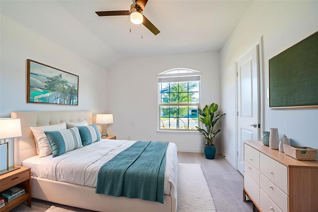 3420 Prairie Place McKinney, TX 75071 - Photo 21 of 37 a bedroom with a large bed and a flat screen tv