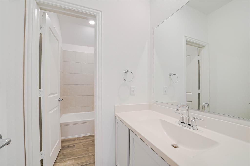 3420 Prairie Place McKinney, TX 75071 - Photo 23 of 37 a bathroom with a sink and a mirror