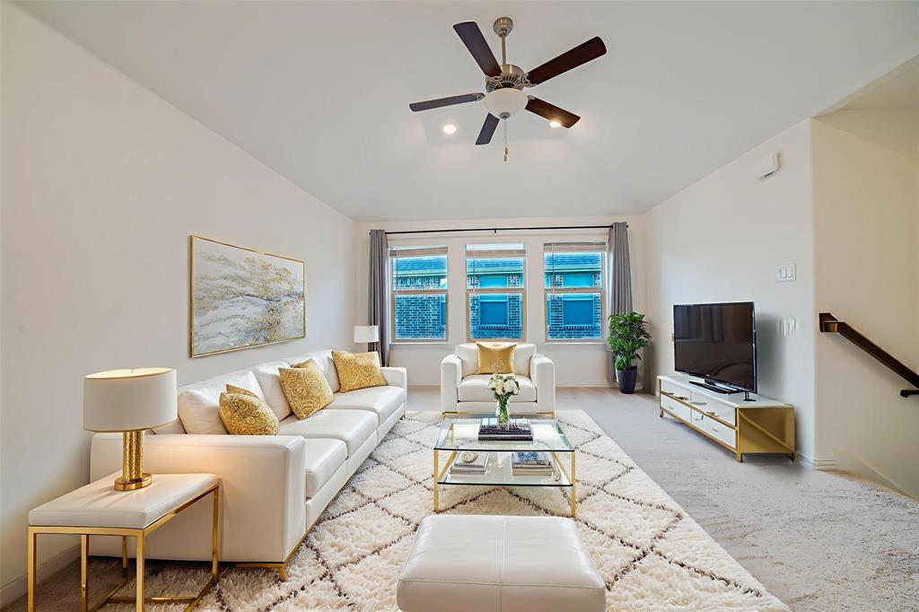 3420 Prairie Place McKinney, TX 75071 - Photo 28 of 37 a living room with furniture and a flat screen tv