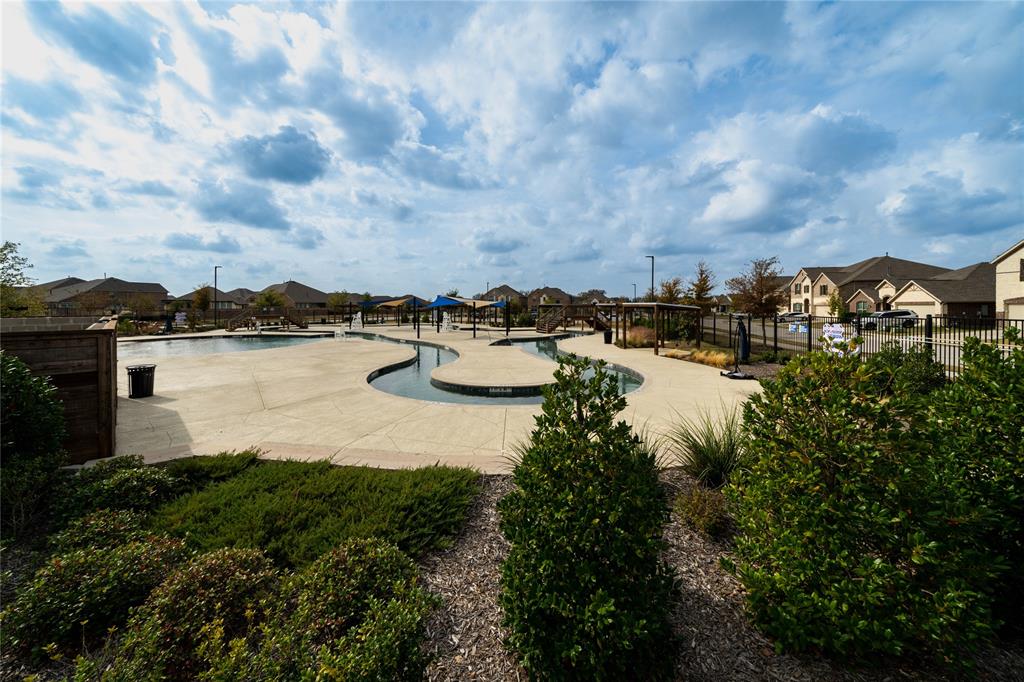 3420 Prairie Place McKinney, TX 75071 - Photo 37 of 37 a view of a lake with houses in the back