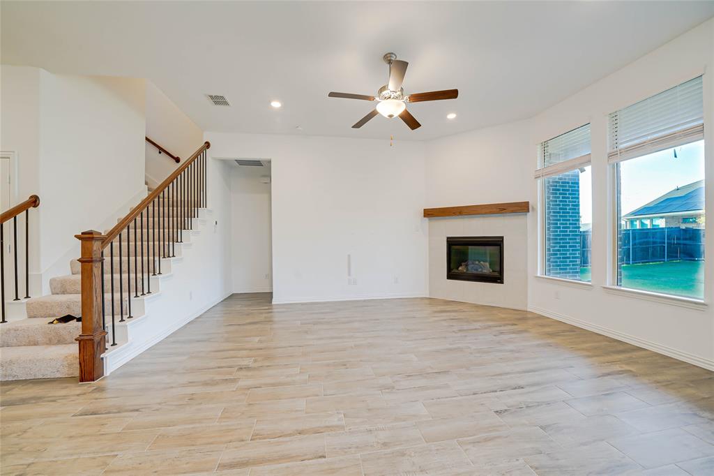 3420 Prairie Place McKinney, TX 75071 - Photo 6 of 37 a view of empty room with wooden floor and fan