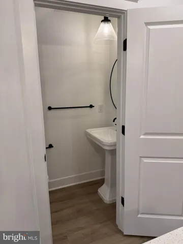 a bathroom with a sink and mirror