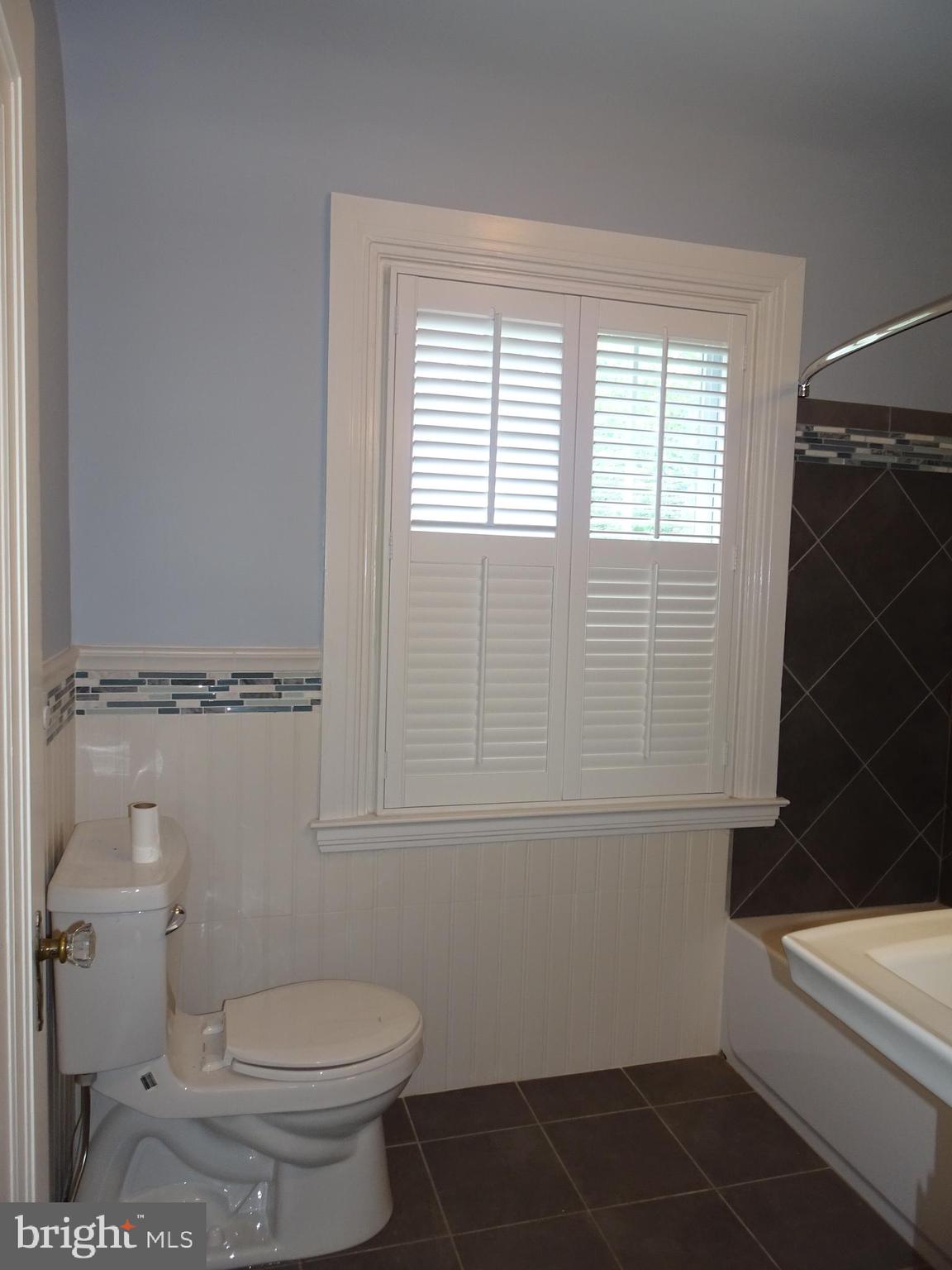 343 Tunbridge Road Baltimore, MD 21212 - Photo 26 of 39 TILE FLOORING AND PEDESTAL SINK