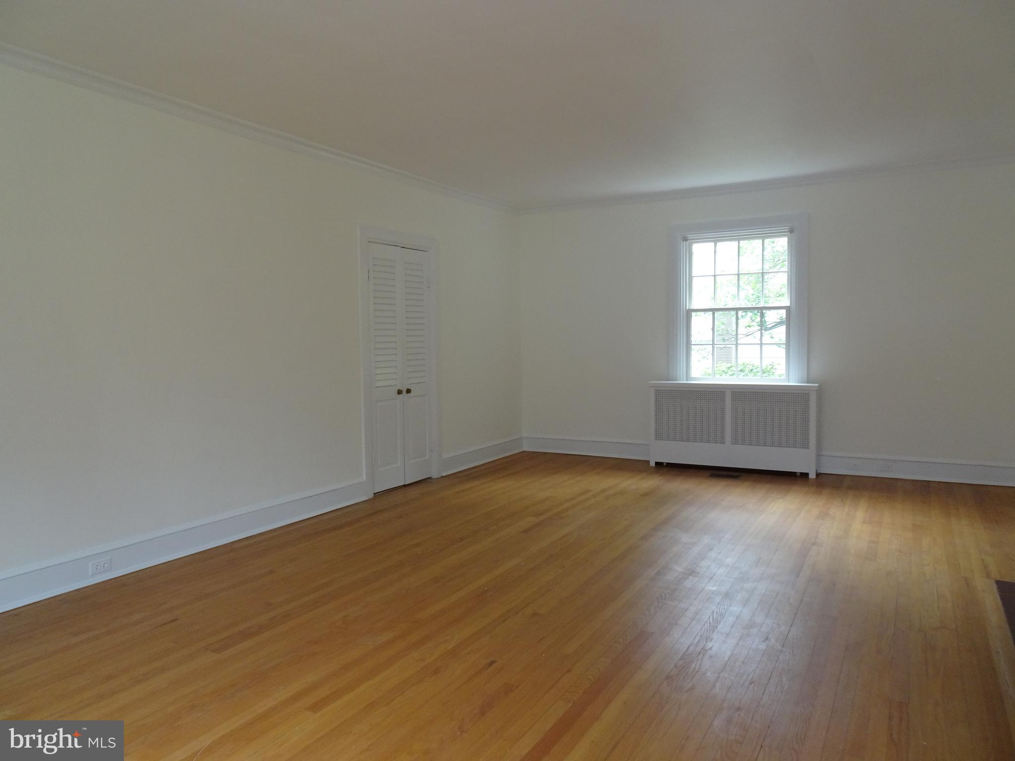 343 Tunbridge Road Baltimore, MD 21212 - Photo 7 of 39 LIVING ROOM WITH WOOD FLOORS AND FIREPLACE