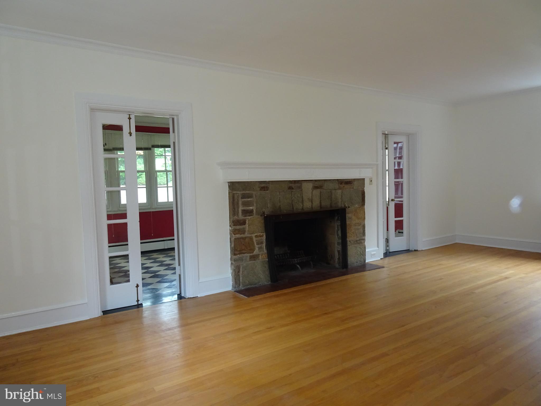 343 Tunbridge Road Baltimore, MD 21212 - Photo 8 of 39 WOOD BURNING FIREPLACE IN THE LIVING ROOM