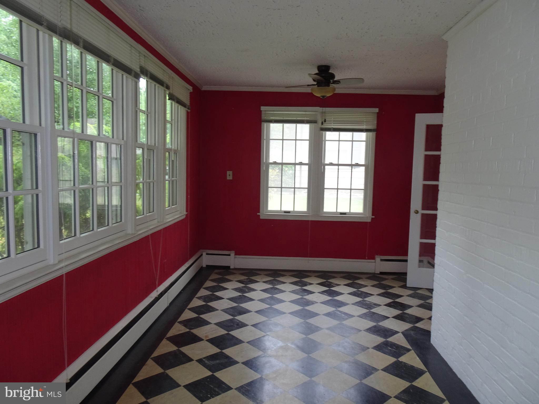 343 Tunbridge Road Baltimore, MD 21212 - Photo 9 of 39 SUNROOM OFF OF THE LIVING ROOM NATURAL LIGHT