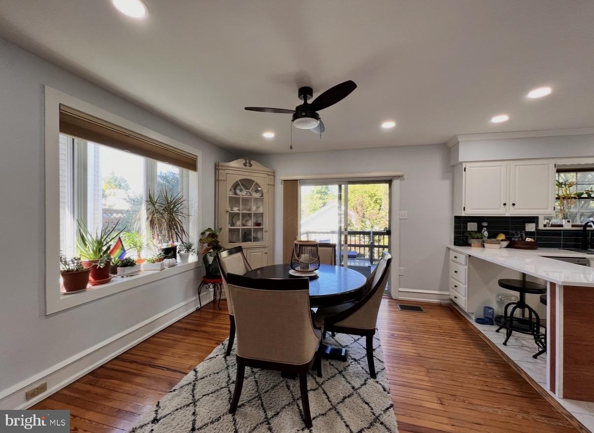 7041 Harvey Avenue Pennsauken, NJ 08109 - Photo 7 of 10 a dining room with furniture a rug and wooden floor