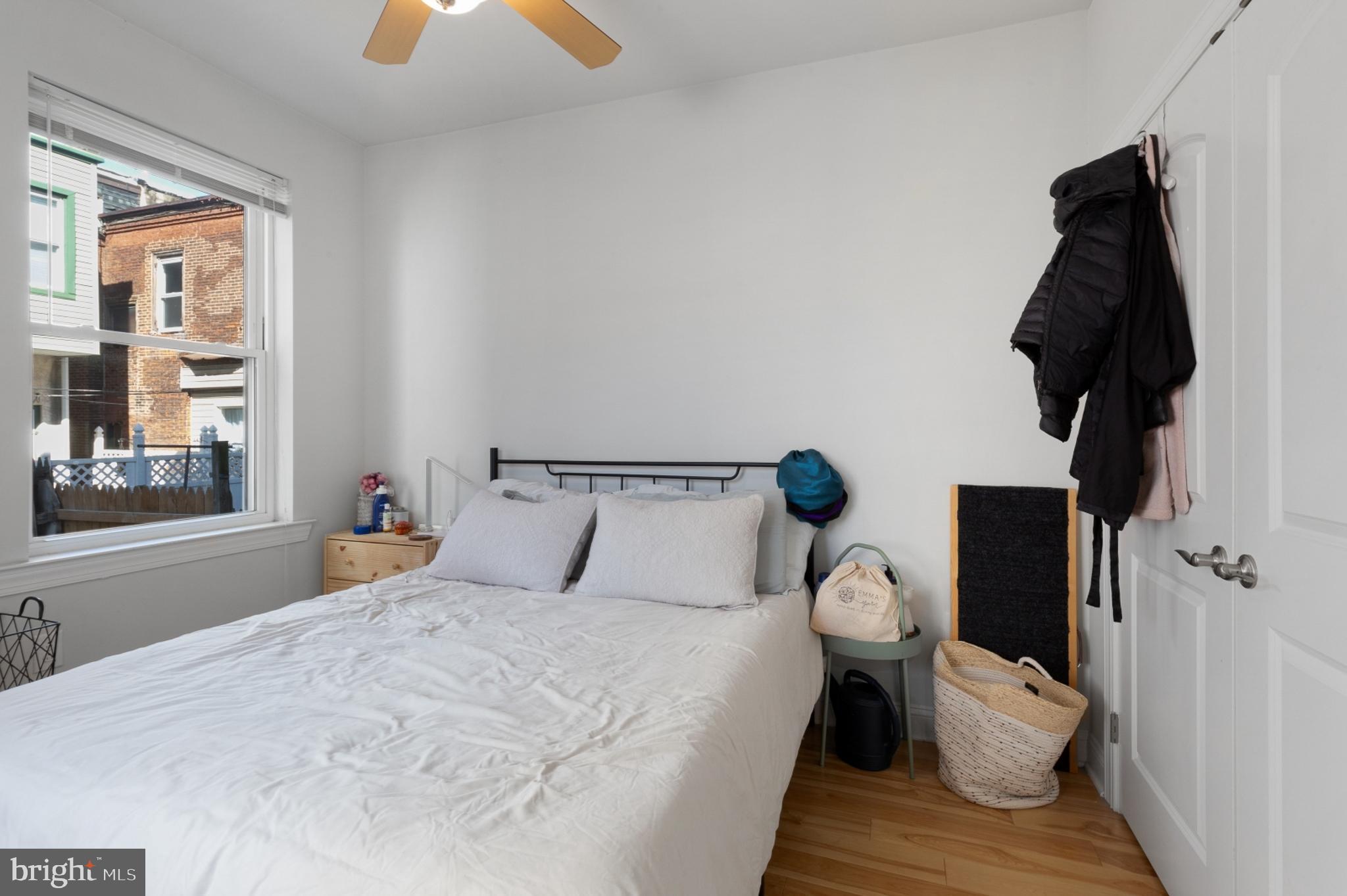 2302 Collins Street Philadelphia, PA 19125 - Photo 13 of 37 a bedroom with a bed and a window