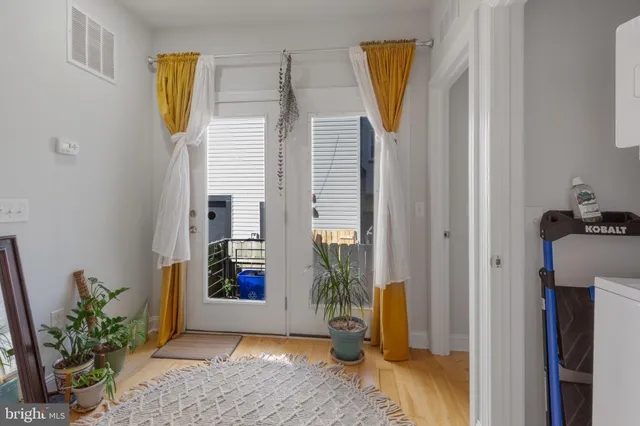 a view of an entryway with wooden floor