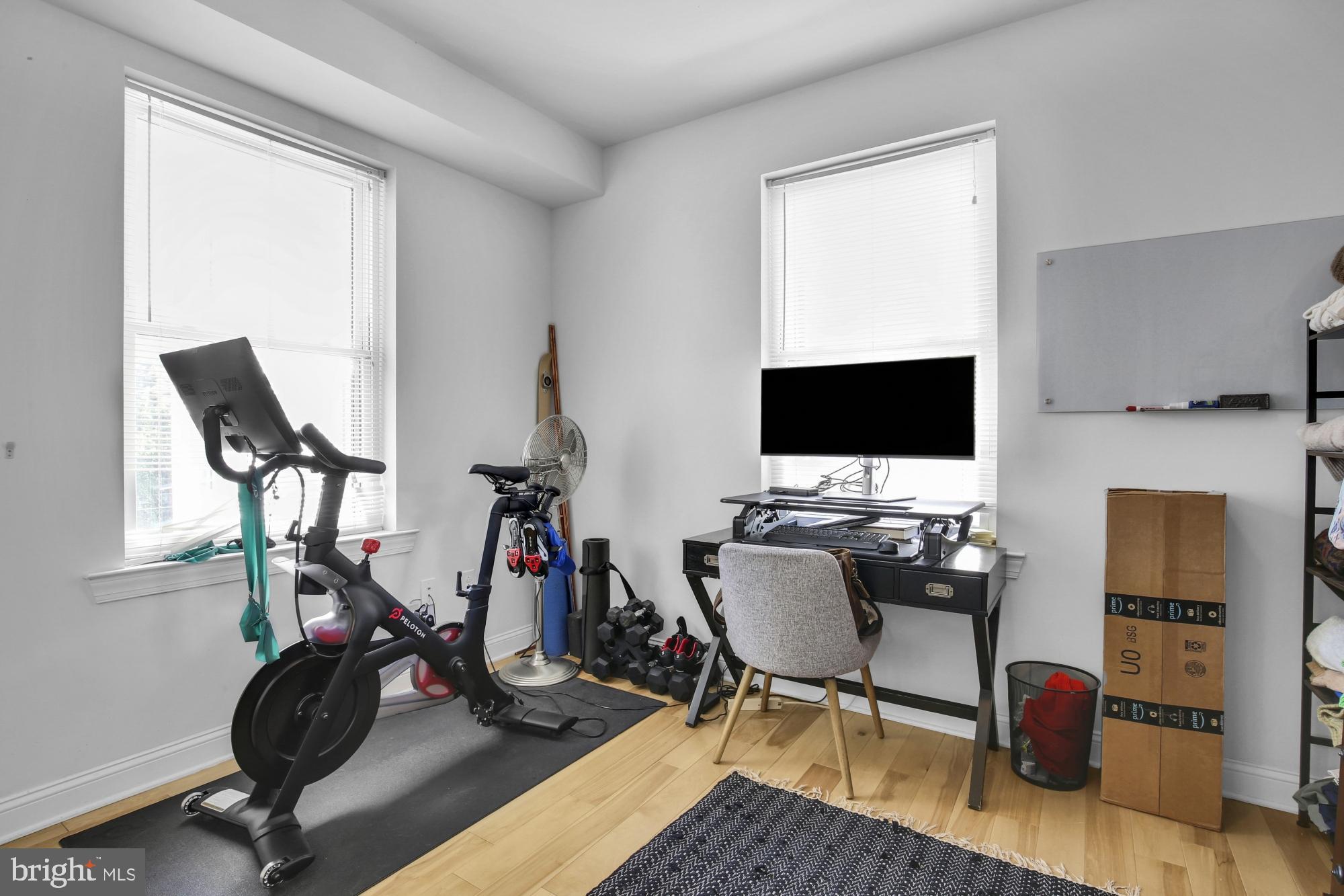 2302 Collins Street Philadelphia, PA 19125 - Photo 18 of 37 a view of a workspace with furniture and a flat screen tv