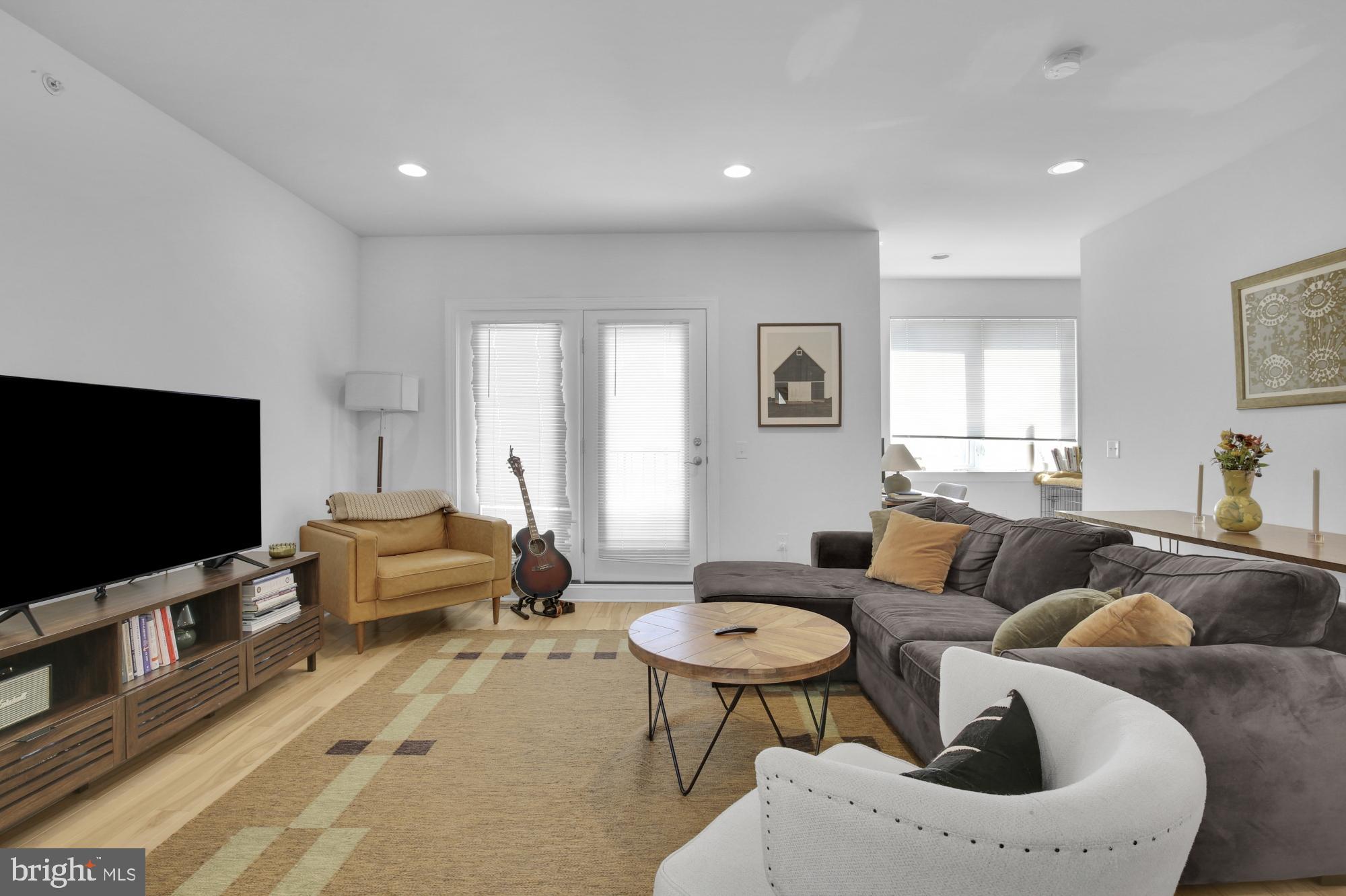 2302 Collins Street Philadelphia, PA 19125 - Photo 26 of 37 a living room with furniture and a flat screen tv