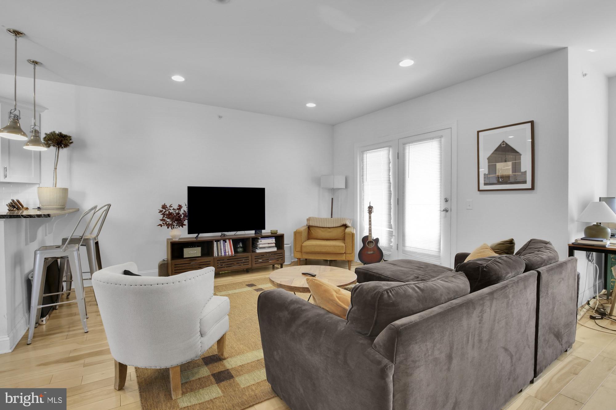 2302 Collins Street Philadelphia, PA 19125 - Photo 28 of 37 a living room with furniture and a flat screen tv
