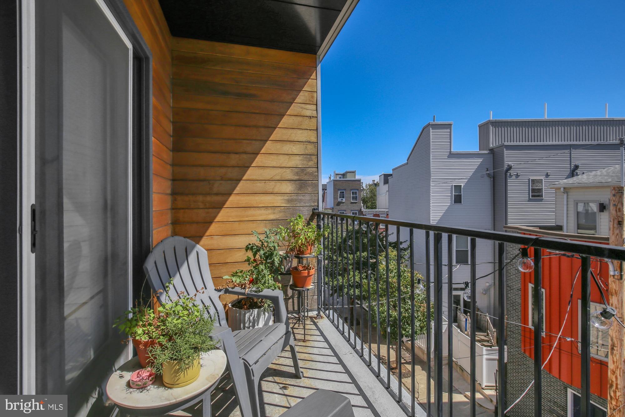 2302 Collins Street Philadelphia, PA 19125 - Photo 33 of 37 a balcony with outdoor seating and plants