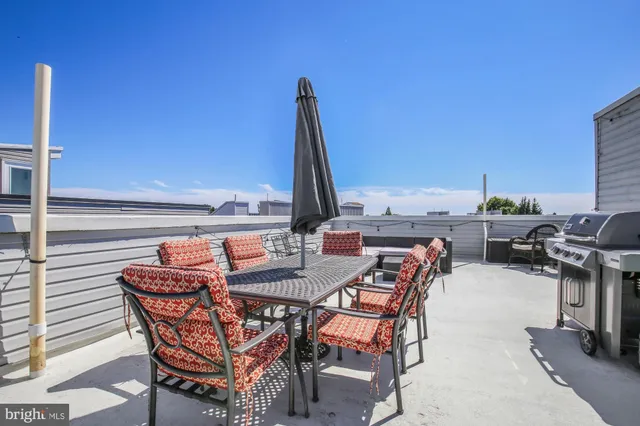 a view of a terrace with furniture and stove