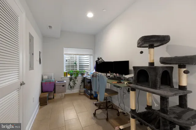 a bedroom with furniture and a window