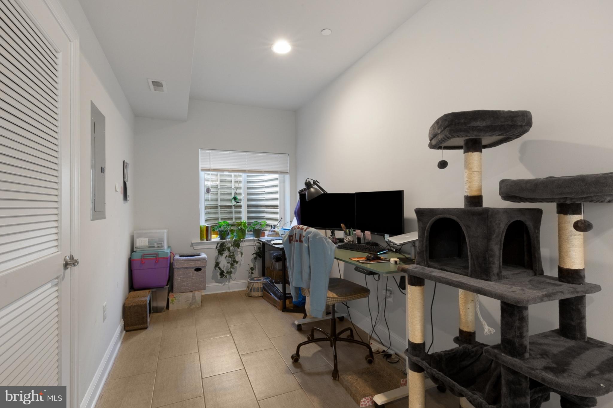 2302 Collins Street Philadelphia, PA 19125 - Photo 6 of 37 a bedroom with furniture and a window