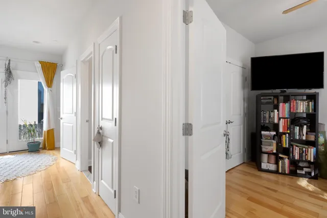 a view of a livingroom with furniture and a flat screen tv