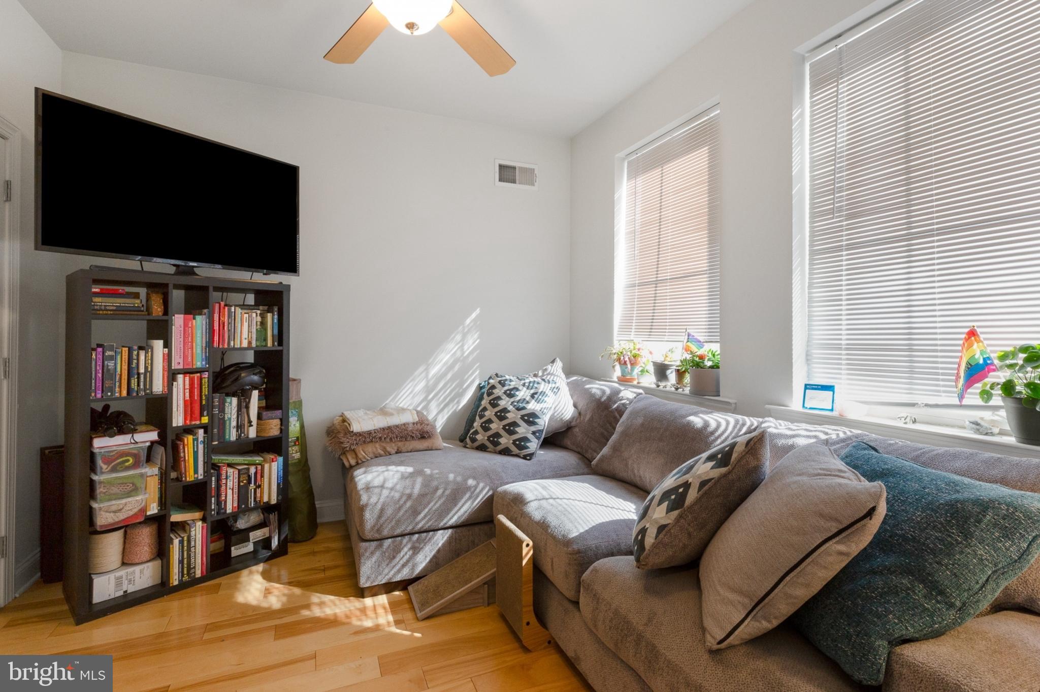 2302 Collins Street Philadelphia, PA 19125 - Photo 8 of 37 a living room with furniture and a flat screen tv