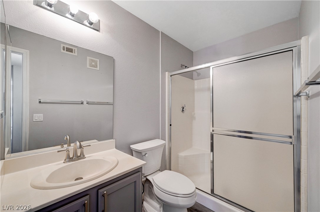 3425 East Russell Road, Unit 223 Las Vegas, NV 89120 - Photo 31 of 47 A well-appointed bathroom features a practical shower enclosure and a sleek vanity with ample counter space.