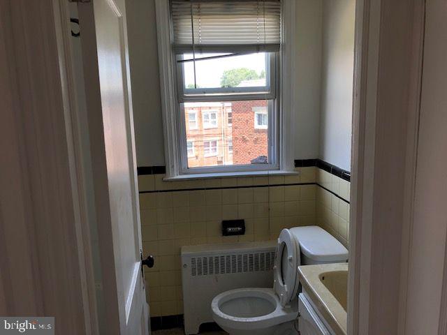 822 822-2nd Road Drexel Hill, PA 19026 - Photo 13 of 13 a bathroom with a toilet a sink a window and a shower