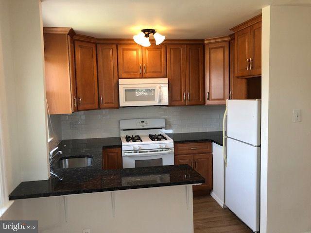 822 822-2nd Road Drexel Hill, PA 19026 - Photo 8 of 13 a kitchen with a stove and a refrigerator