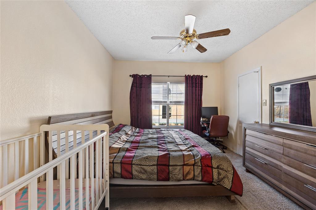 4115 Esters Road, Unit 710 Irving, TX 75038 - Photo 11 of 14 a bedroom with a bed and windows